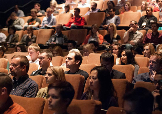 audiences in amphitheater hearing to a speaker